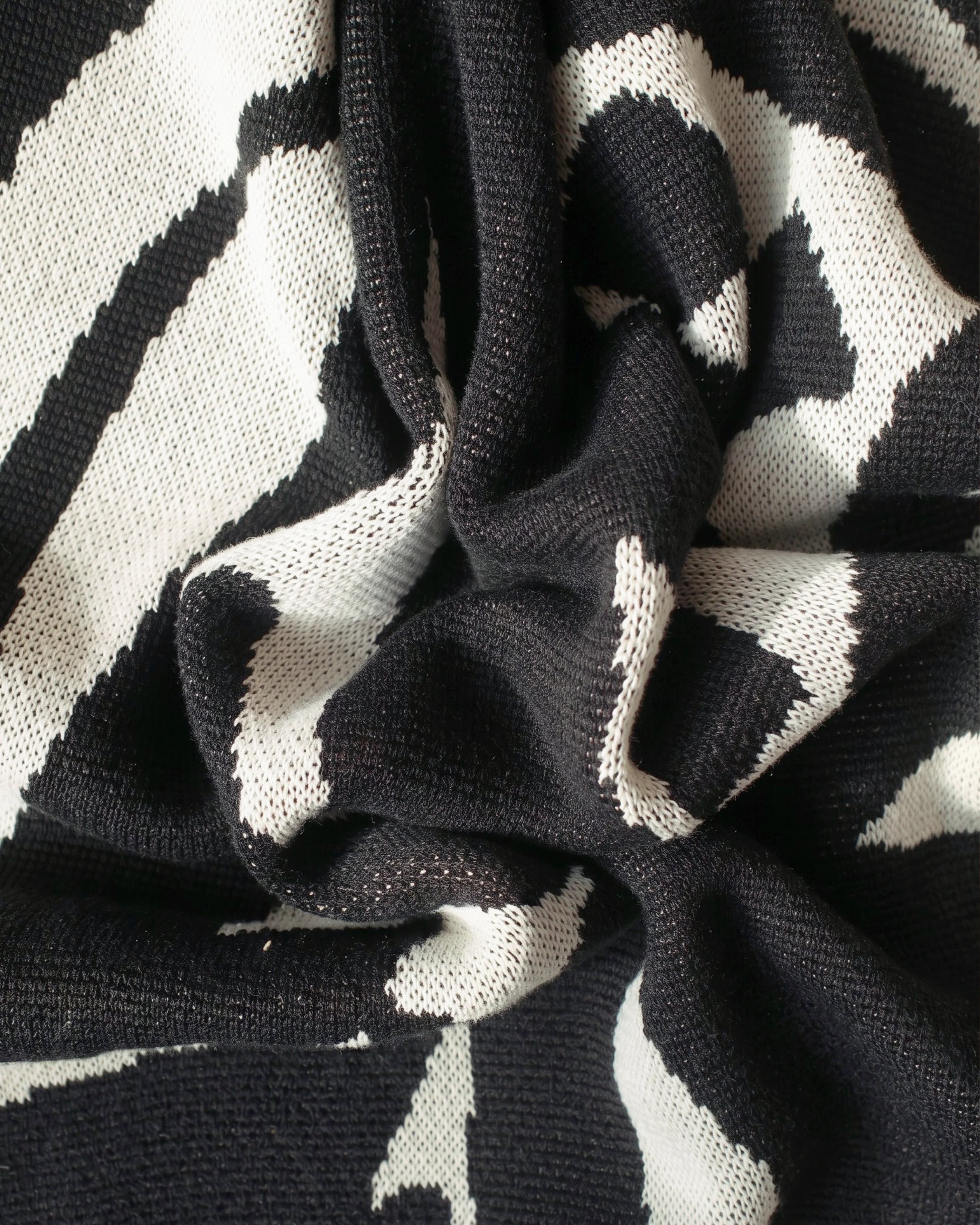 Plume Throw by Aadil Abedi